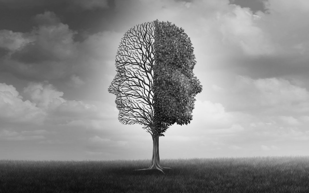 A tree in the shape of human faces with cloudy sky illustrating mood disorders