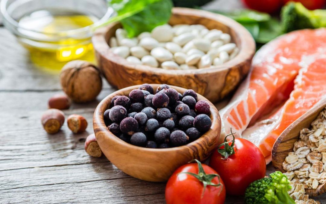 Selection of heart-healthy foods on a wooden table