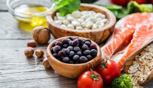 Selection of heart-healthy foods on a wooden table